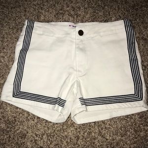 white shorts with navy detail